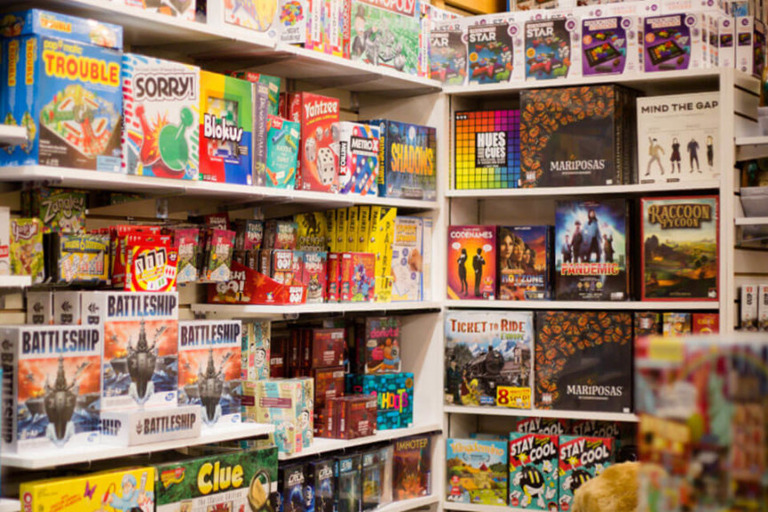 Shelves filled with various toys and games