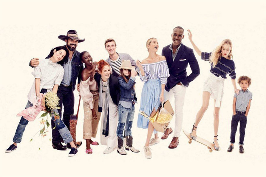 Several people posing for a group photo dressed in J.Crew clothing